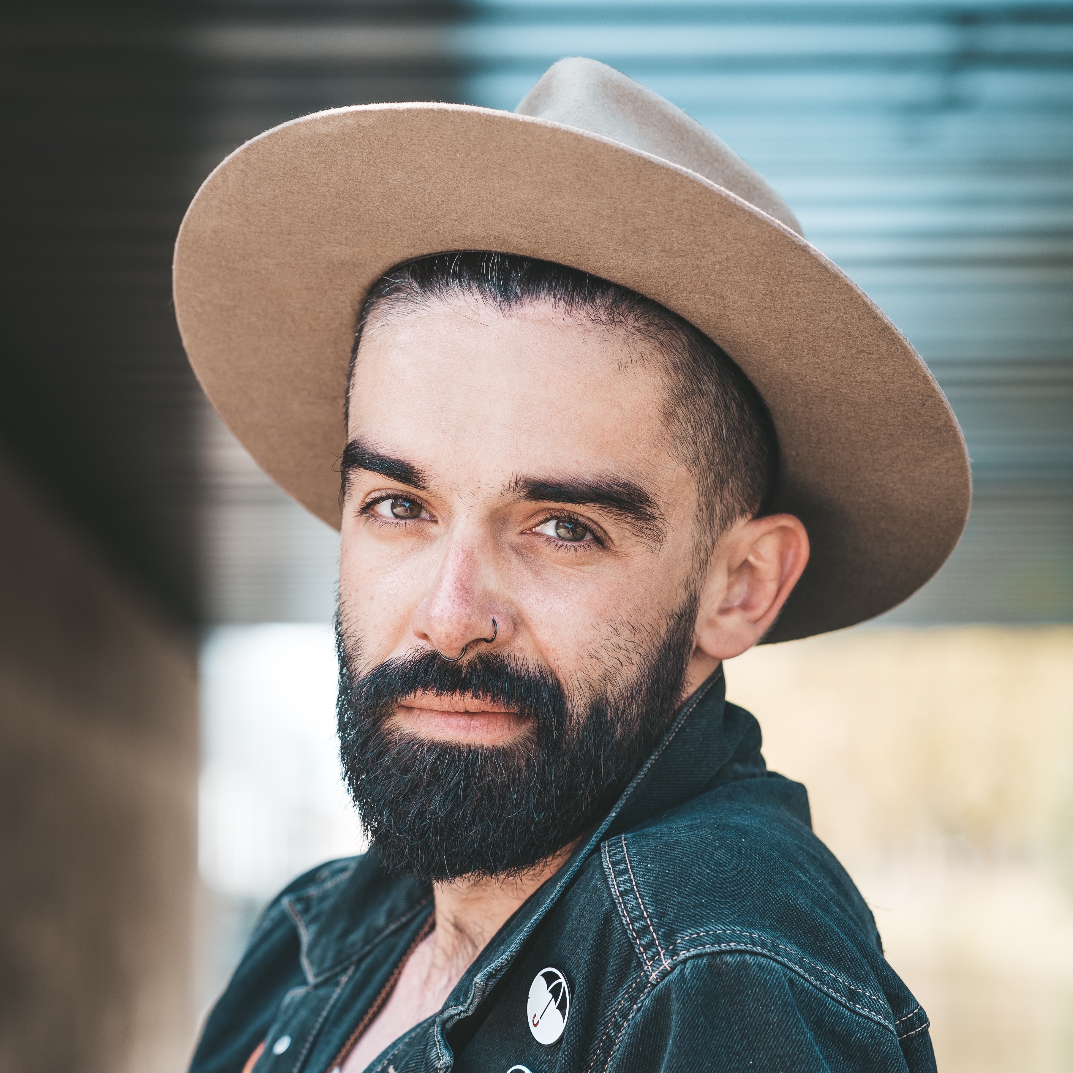 Man with neatly trimmed beard wearing hat