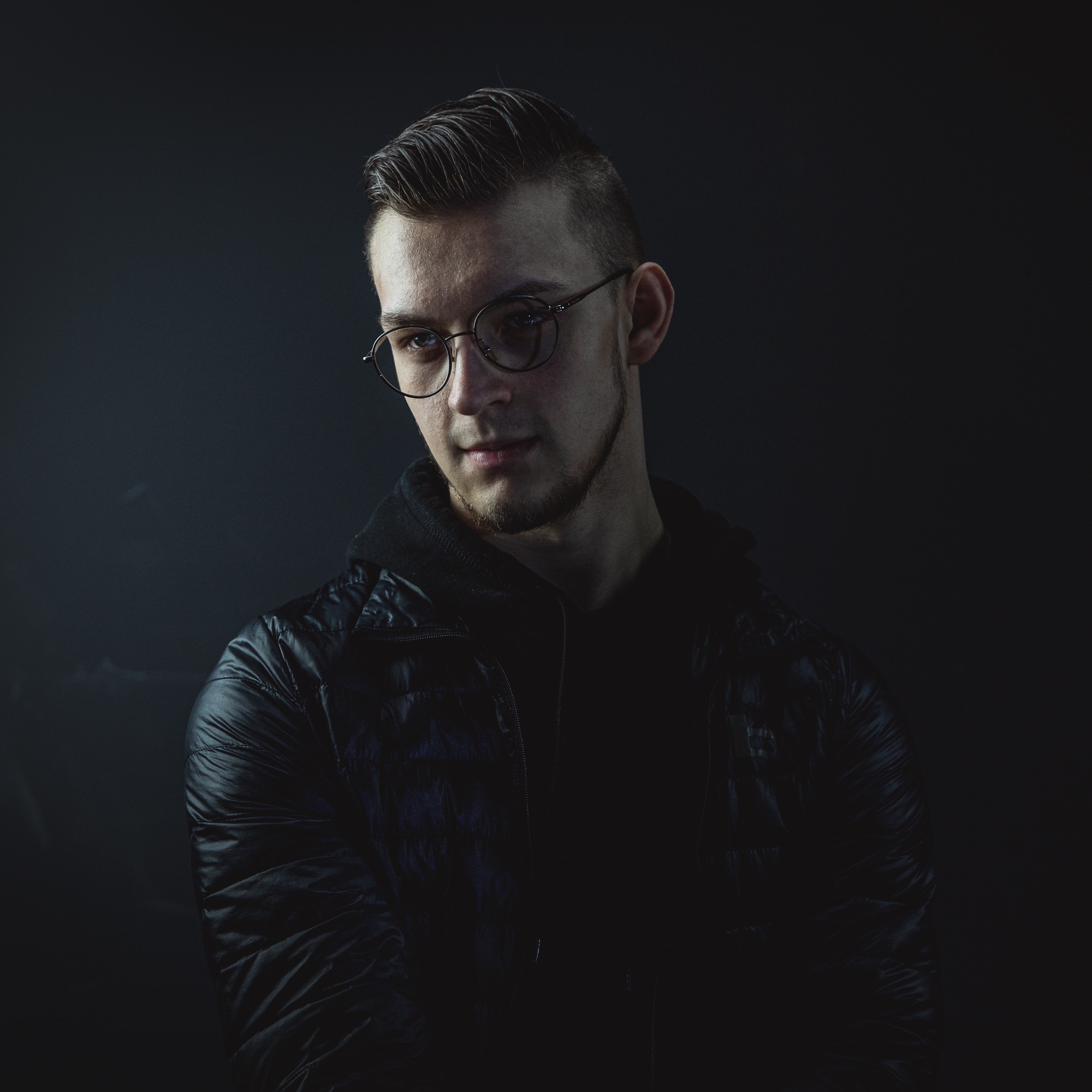 Man with longer waxed hair with sides shaved