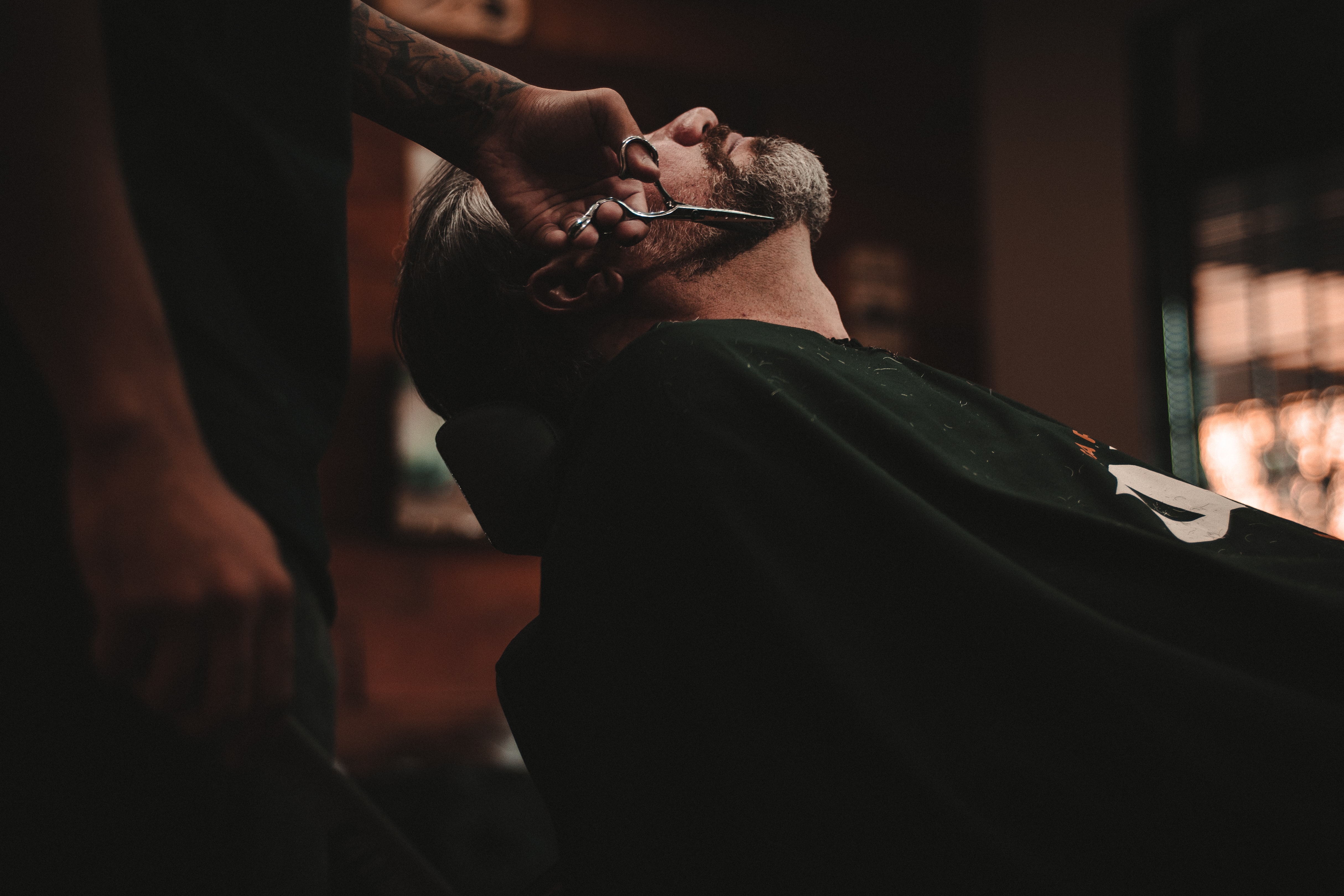 Man getting his beard trimmed